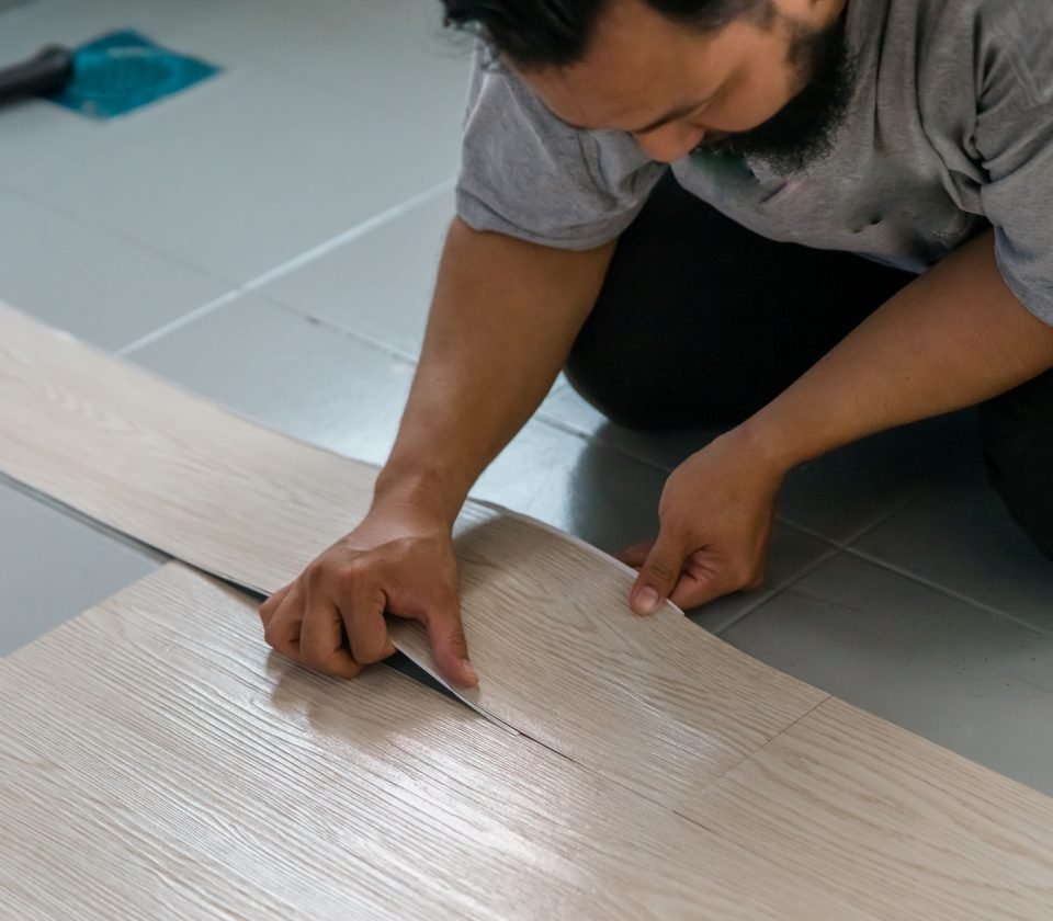 vinyl-floor-installation-worker-diy-at-home-.jpg